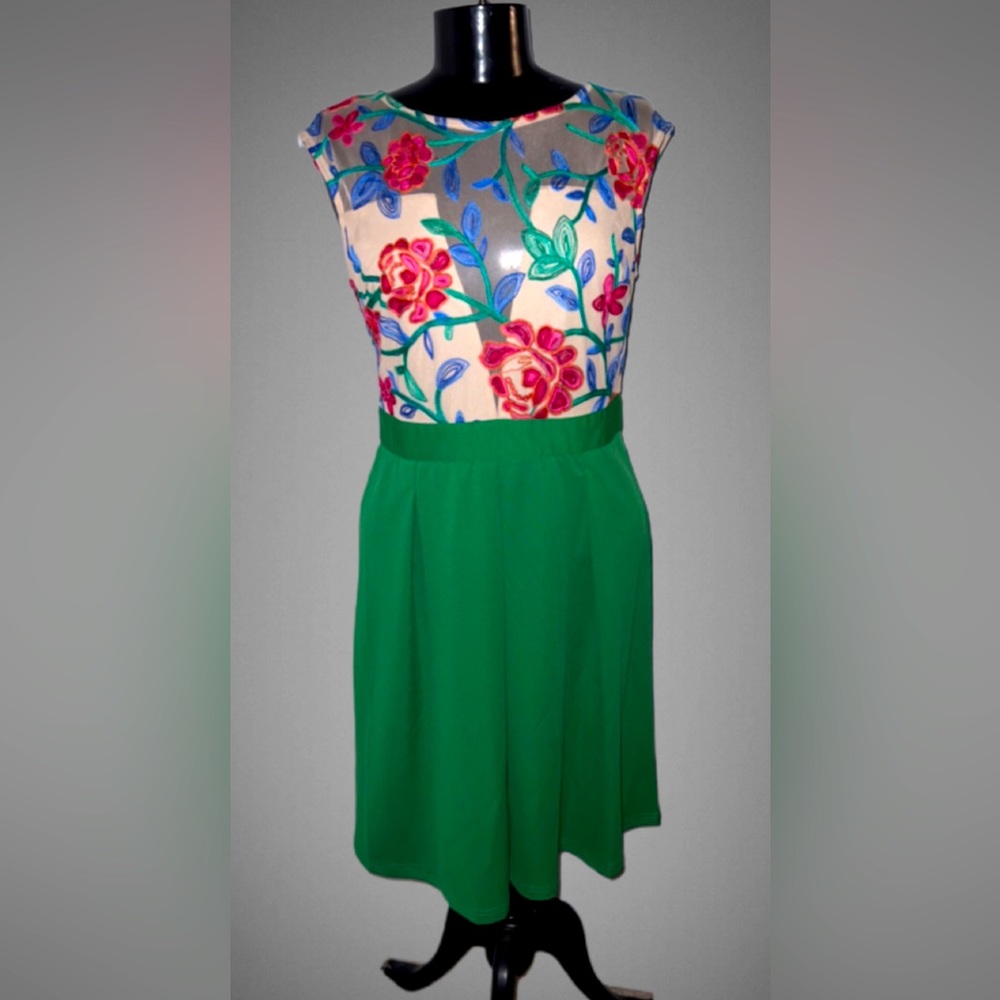 Floral embroidered green dress with sheer top.